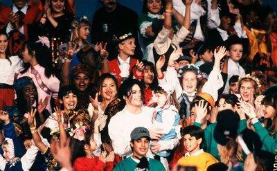 Michael Jackson performs with hundreds of children at the Superbowl XXVII halftime show.